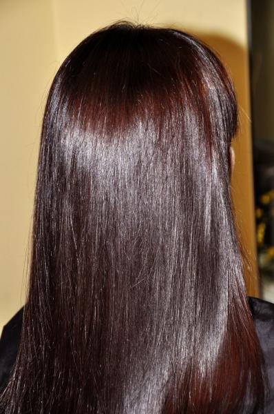 Dark brown hair colour with a purple tinge